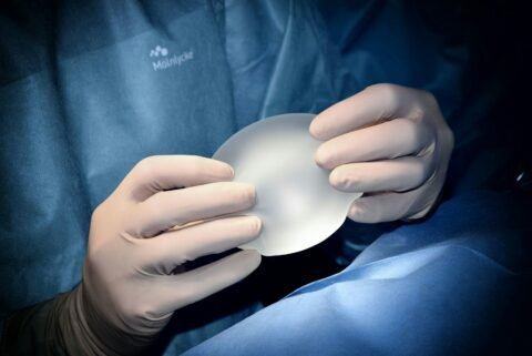 breast augmentation vs implants